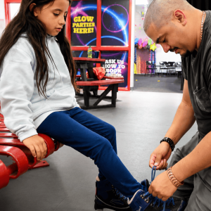 Dad tying Skates